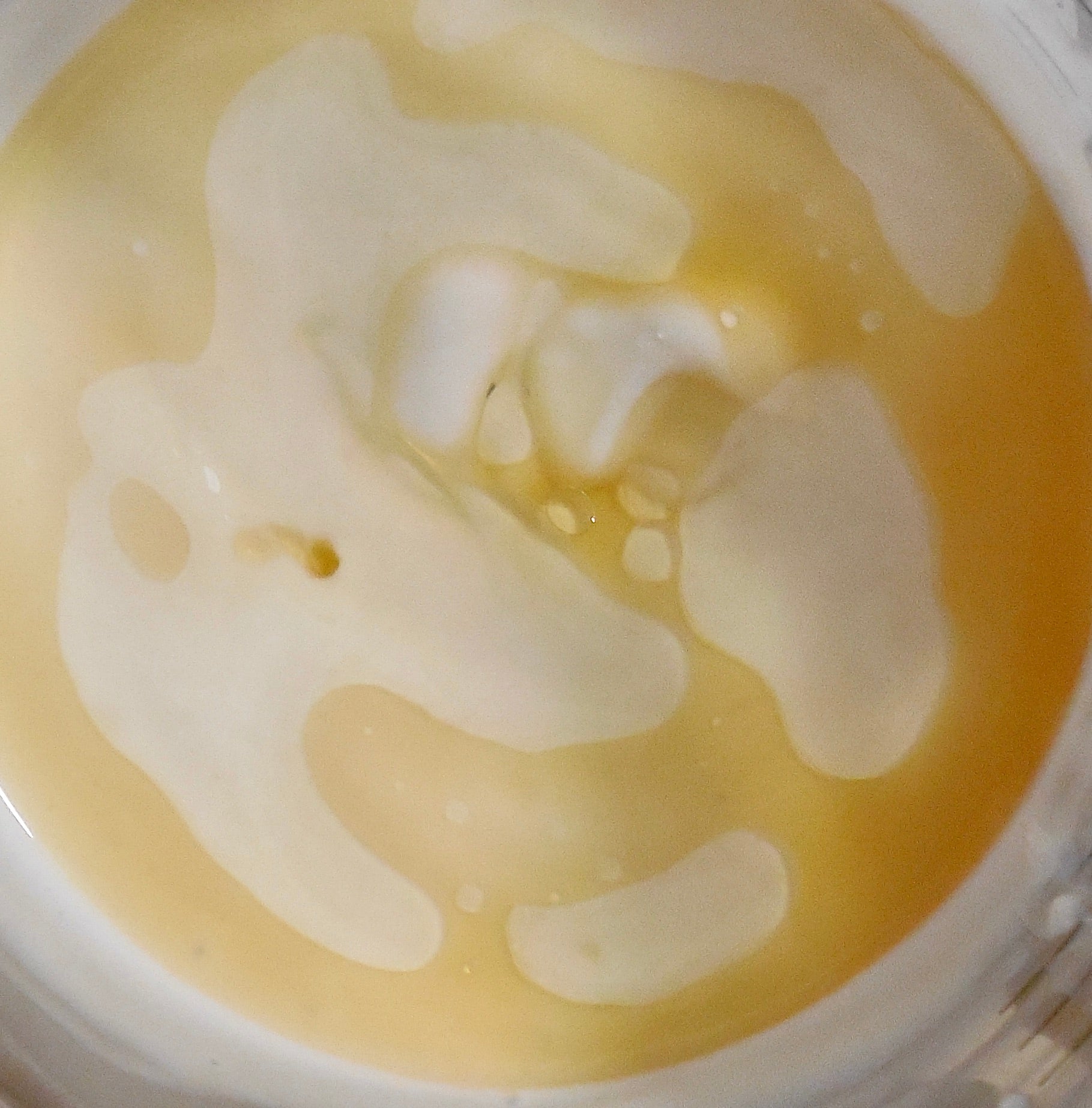 Vitamin e tocopheryl acetate tocopherol oil soluble antioxidant in skincare cosmetics liquid oil texture close up shot