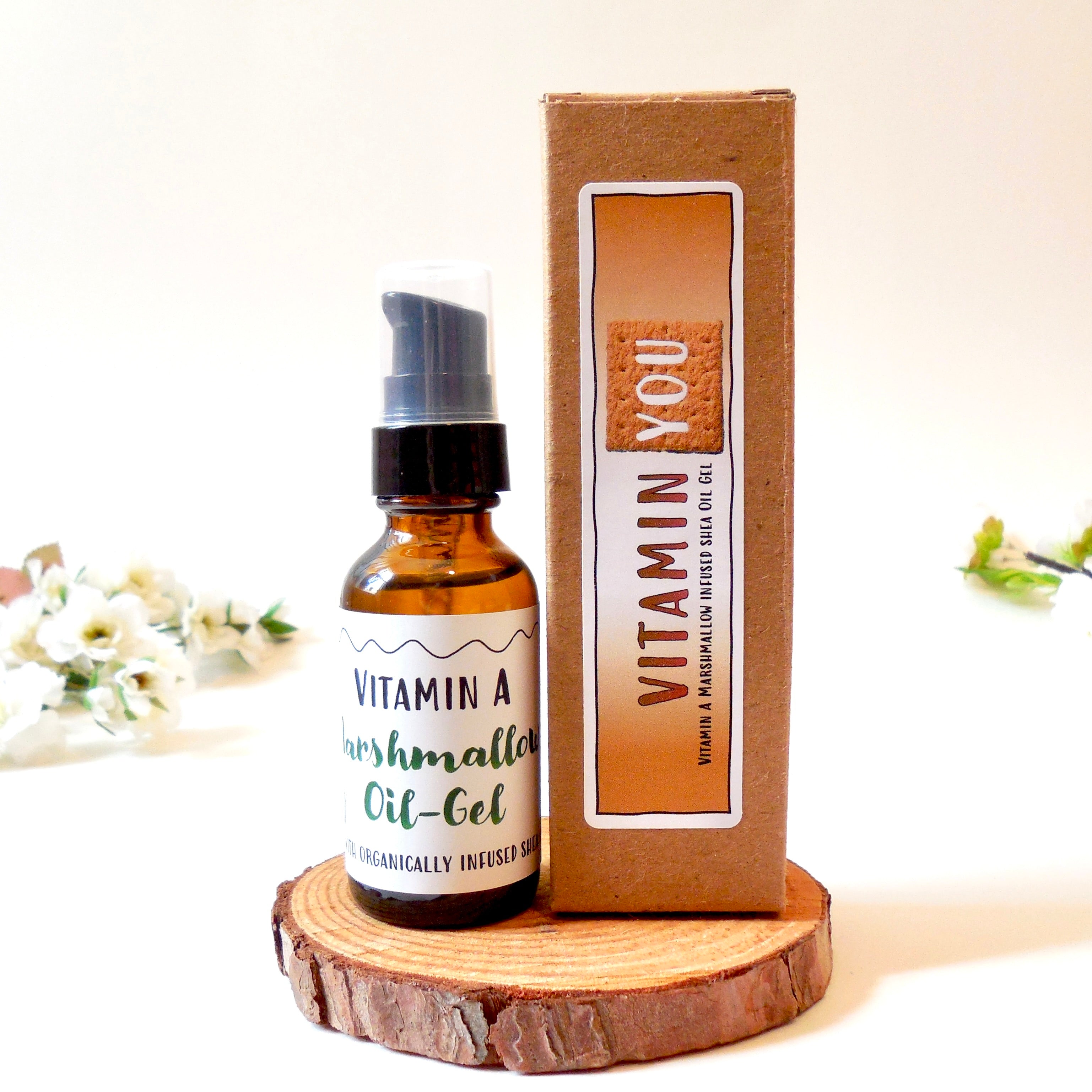 Vitamin A marshmallow oil-gel bottle and box on a wooden stand with a white background with natural aesthetic