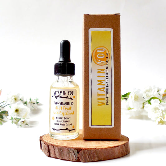 Vitamin You Vitamin B5 AHA Fruit Acid Exfoliant clear dropper bottle and kraft packaging.