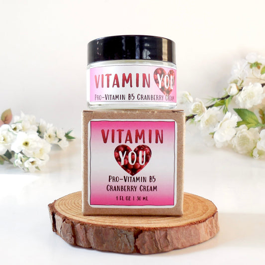 Vitamin You Vitamin B5 Cranberry Butter Cream jar and box with a maroon-pink cranberry theme.
