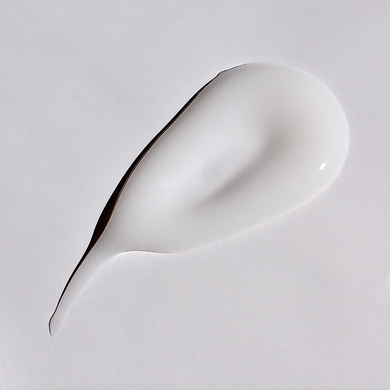 Upclose texture swipe of white hyaluronic acid serum. 