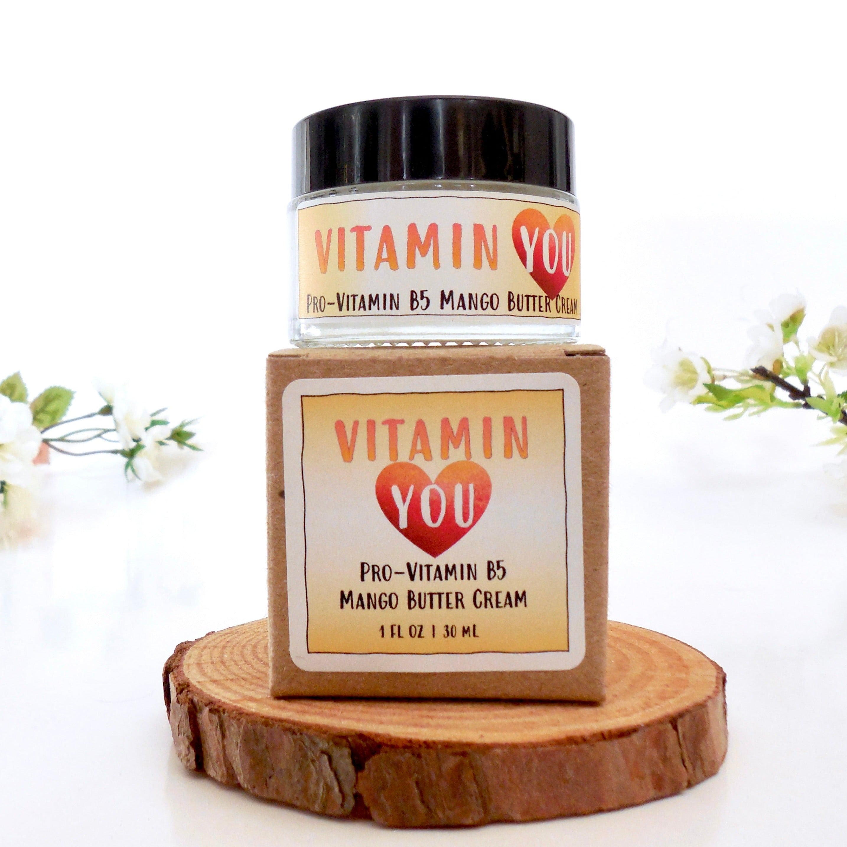 Vitamin You Mango Butter Cream jar and box with a sunset yellow and orange theme.