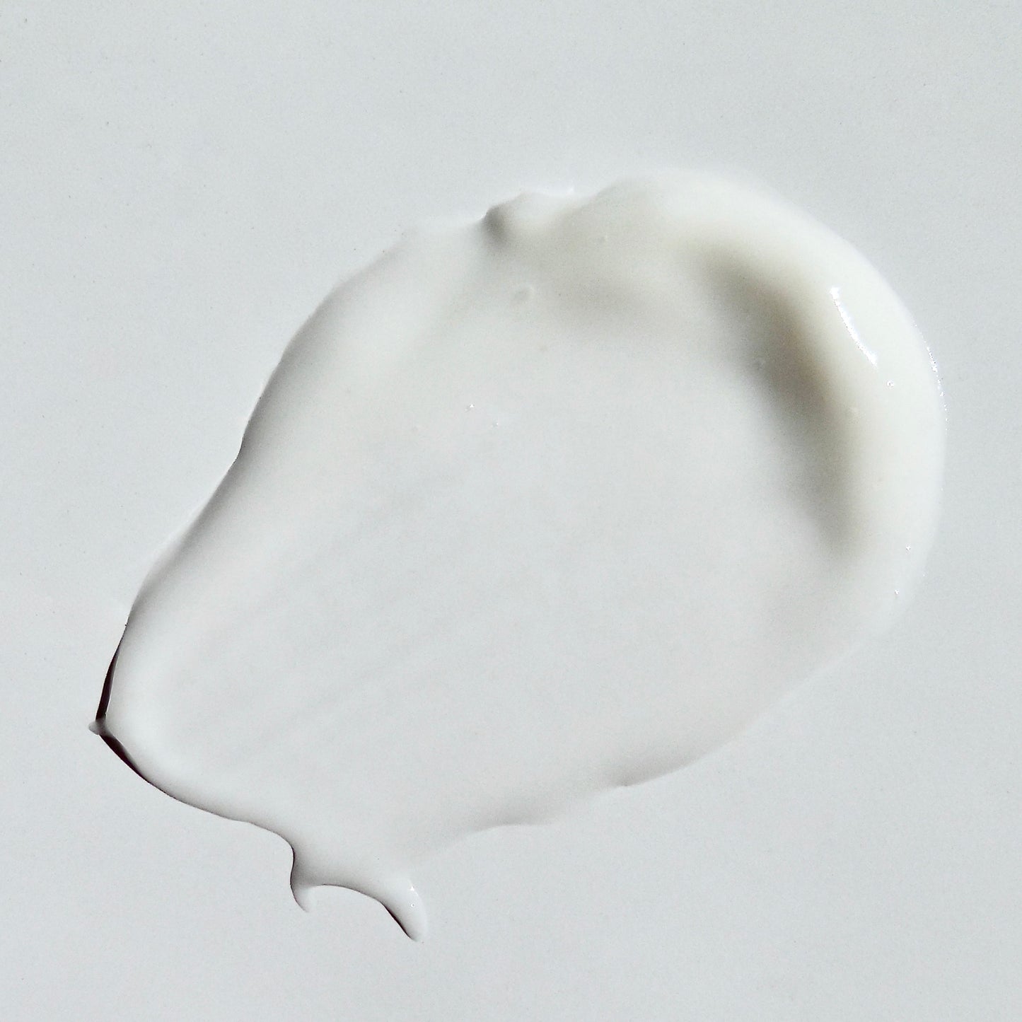 Close up image of soothing oatmeal cream swipe on a white background